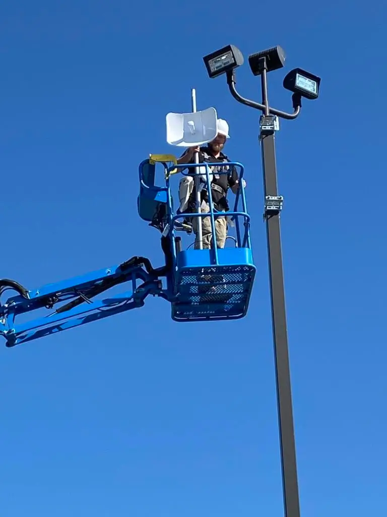 Manlift install to light pole closeup 768x1024